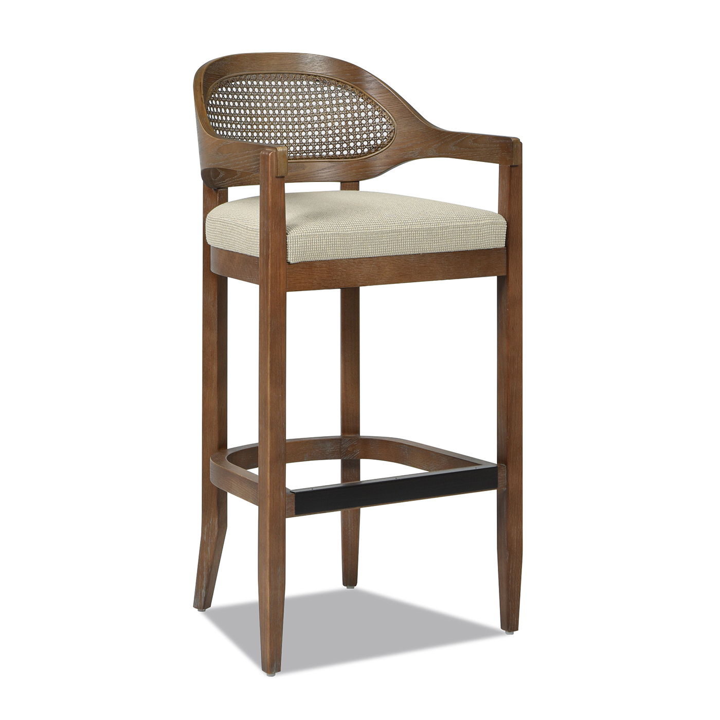 The Americana Mid-Century Modern Cane Back Counter Stool features a curved cane backrest, beige upholstered seat, footrest, and four tapered legs with horizontal supports.