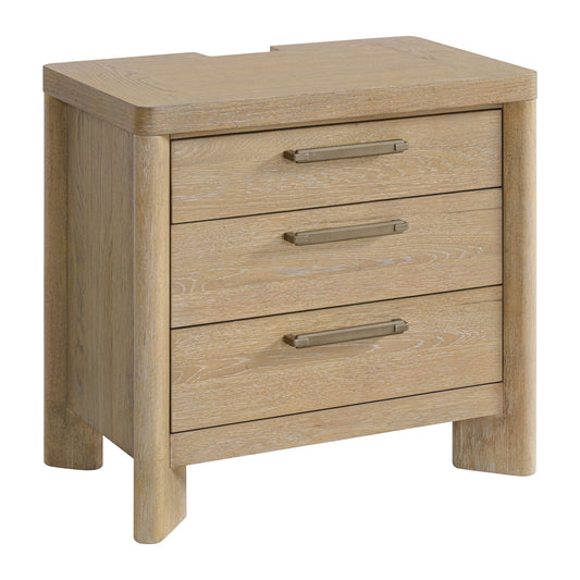 The Clove 3 Drawer Nightstand in tan features a simple, modern design with rounded edges, sturdy legs, metal handles, and a back notch on the top surface for cable management.