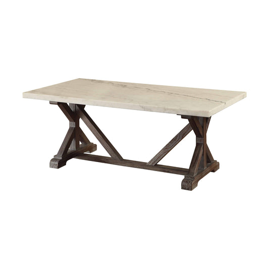 The Romina Marble Top Weathered Coffee Table features a sturdy dark wooden trestle base with angled supports and a rectangular white marble top.