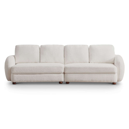 The Paton - Comfortable Sofa is a modern three-seater with plush white upholstery, rounded armrests, and short wooden legs, displayed against a white background.