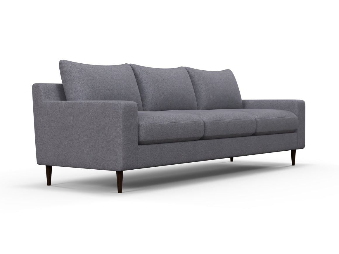 The Alex Sofa is a contemporary piece with clean lines, featuring a minimalist design in gray and three cushions. Its sleek and stylish appearance is enhanced by tapered dark wooden legs.