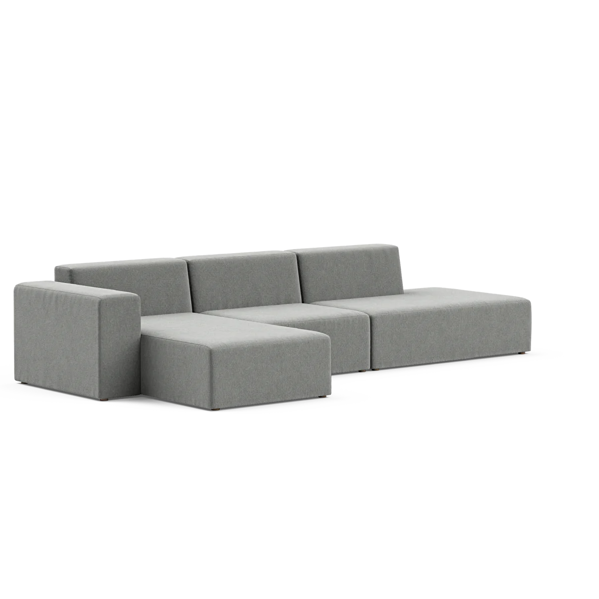 The Three-Seater Form Sectional is a contemporary, minimalist sofa in grey, featuring three seats and a chaise lounge on the left. Its design showcases clean lines and a low profile, all highlighted against a simple background.