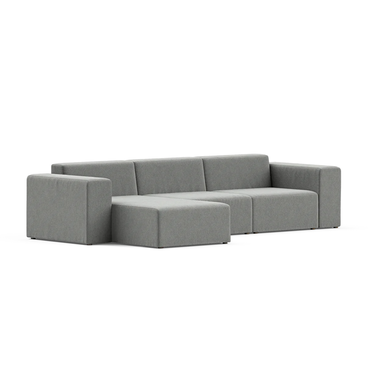 Introducing the Three-Seater Form Sectional: a contemporary gray sofa with a minimalist design, featuring wide armrests and plush cushioned seats. This sectional includes three main seating sections alongside a chaise lounge at one end, perfect for enhancing any modern living room ambiance.