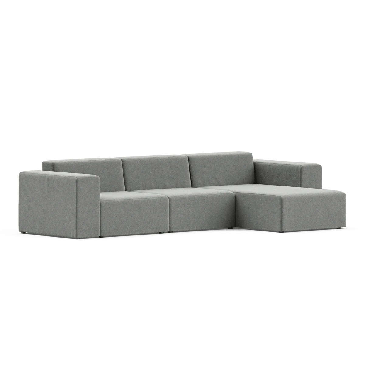 The Three-Seater Form Sectional is a modern gray sofa with a minimalist design, featuring a right-facing chaise lounge. It has clean lines and cushioned seats, making it ideal for a contemporary living room.