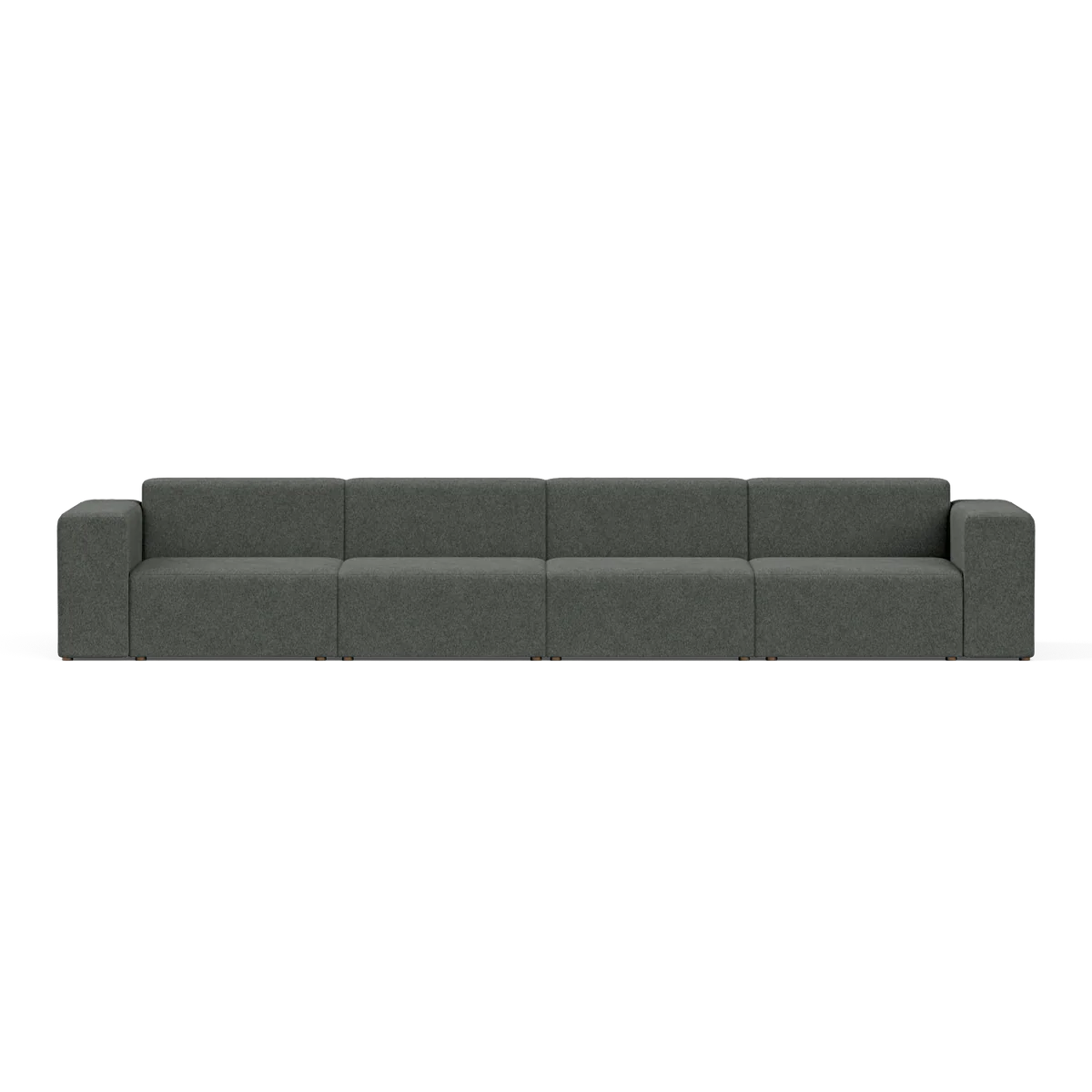 The Four-Seater Form Sectional is a long, modern sofa in dark gray featuring four evenly spaced sections and boxy armrests, set against a plain white background. Its minimalist design provides ample seating space.