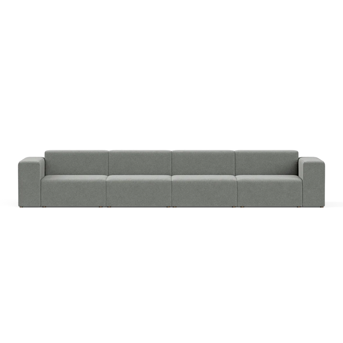 A large, modern Four-Seater Form Sectional in gray is showcased against a plain backdrop. Its minimalist design includes four wide seats and square armrests, offering a sleek and contemporary appearance.