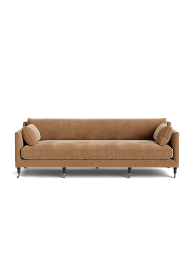 The Fabienne Sofa, featuring a brown upholstered design with wooden legs and two matching cylindrical pillows on either side, is set against a plain white background.