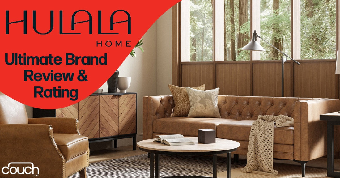 Modern living room with a brown leather sofa, accent pillows, a floor lamp, a wooden coffee table, and a sideboard. Large windows offer a view of green trees. Overlaid text reads: "HULALA HOME Ultimate Brand Review & Rating." Logo: "Couch.com.
