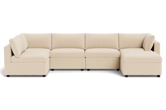 The Kova Box Cushion U-Shape is a beige, modern sectional sofa with clean lines and plush cushions, shown from the front against a plain background.