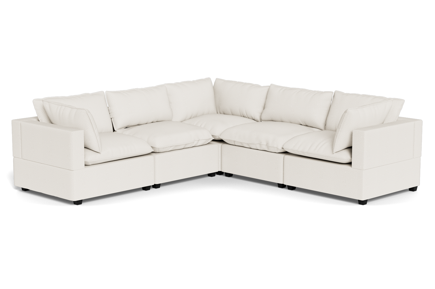 The Kova Pillow Cushion Corner Sectional is a spacious L-shaped sofa featuring cream upholstery and plush back and seat cushions.
