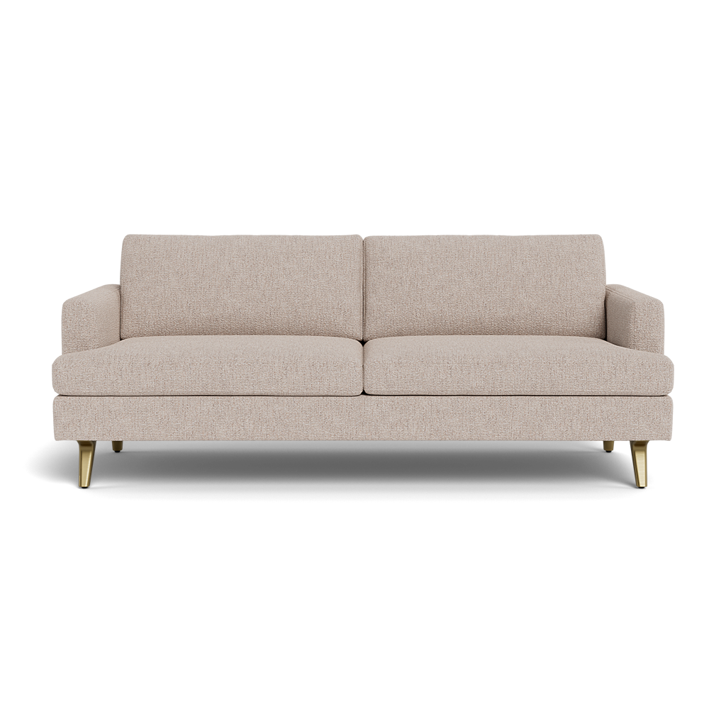 The Lido Sofa 75" is a modern beige fabric sofa featuring two seat and back cushions, low arms, and four gold metal legs, displayed against a black background.