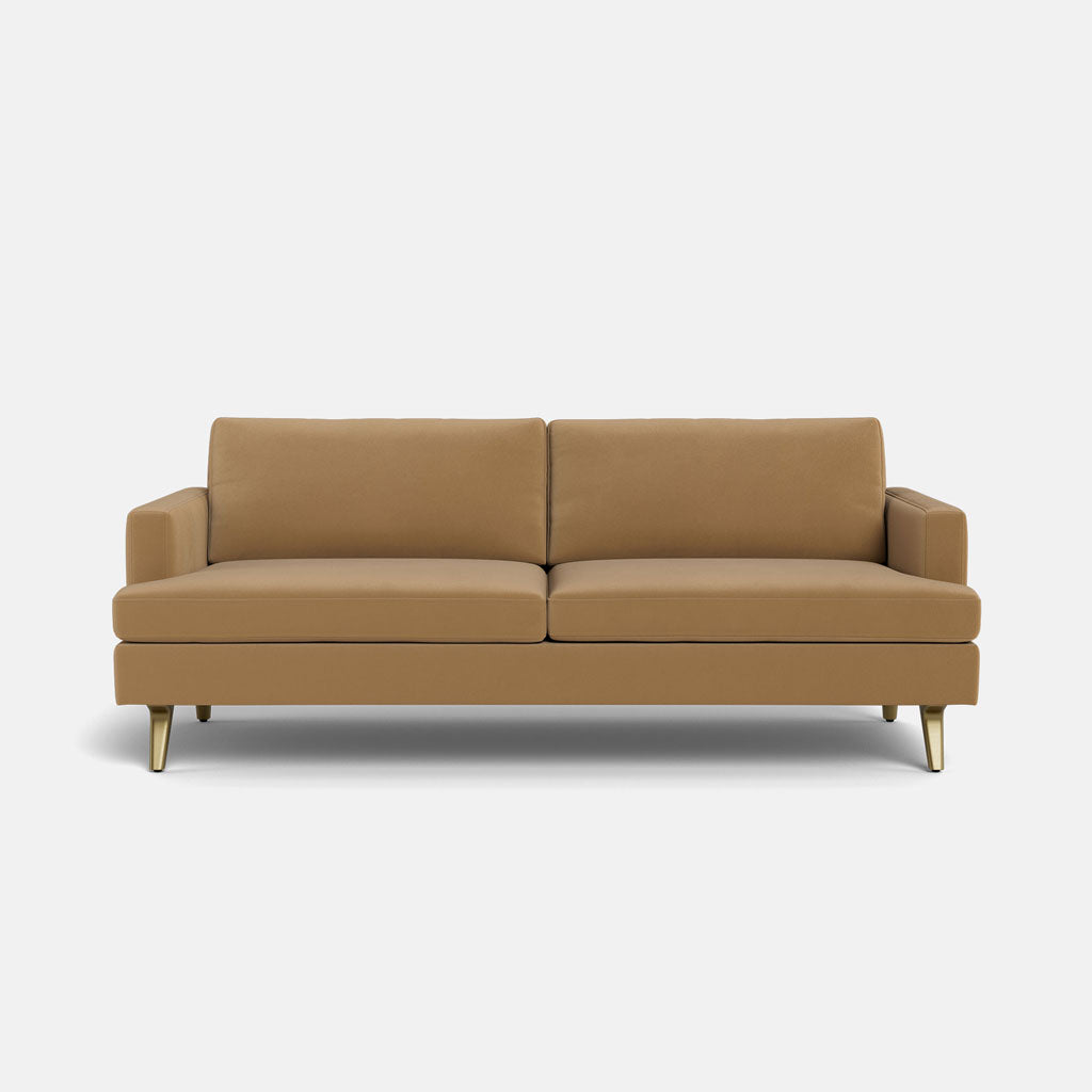 The Lido Sofa 75" features a modern design in light brown with two seat and back cushions, low arms, and short angled wooden legs, shown here against a plain white background.
