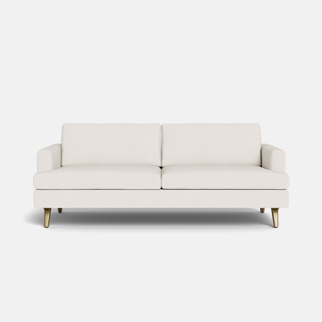 The Lido Sofa 75" is a modern white upholstered sofa with two seat cushions, two back cushions, low arms, and angled wooden legs, shown against a plain white background.