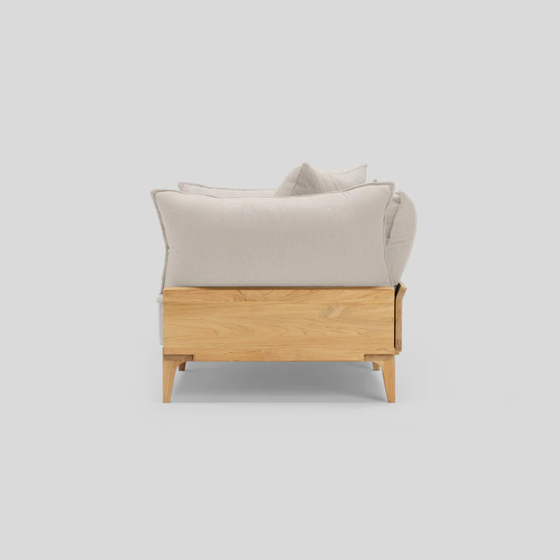 Side view of the Bluff Loveseat, featuring a modern design with a light wooden frame and light gray cushions, set against a plain background.