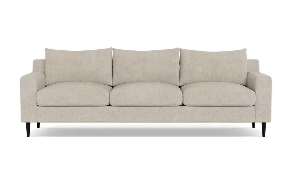 The Sloan Custom 3-Seat 95" Sofa, featuring plush cushions and sleek black legs, is displayed against a plain background. Its simple and modern design offers a contemporary look.