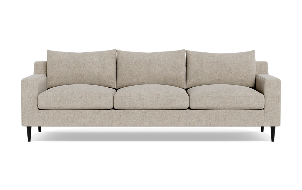 The Sloan Custom 3-Seat 95" Sofa, in beige, showcases a minimalist design with rectangular cushions and armrests. This three-seater sofa is supported by dark wooden legs and is highlighted against a simple backdrop.