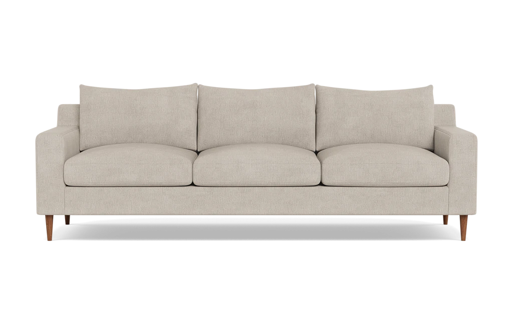 The Sloan Custom 3-Seat 95" Sofa is a modern beige sofa featuring streamlined, rectangular cushions and slim wooden legs, positioned against a plain black background.