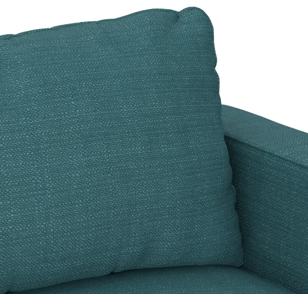 Close-up of a Sactionals - 7 Seats + 8 Sides Mediterranea Solid Polylinen cushion on a couch. The fabric features a dotted pattern, and the cushion is placed at the top corner of the sofa, showcasing its plump, soft appearance.