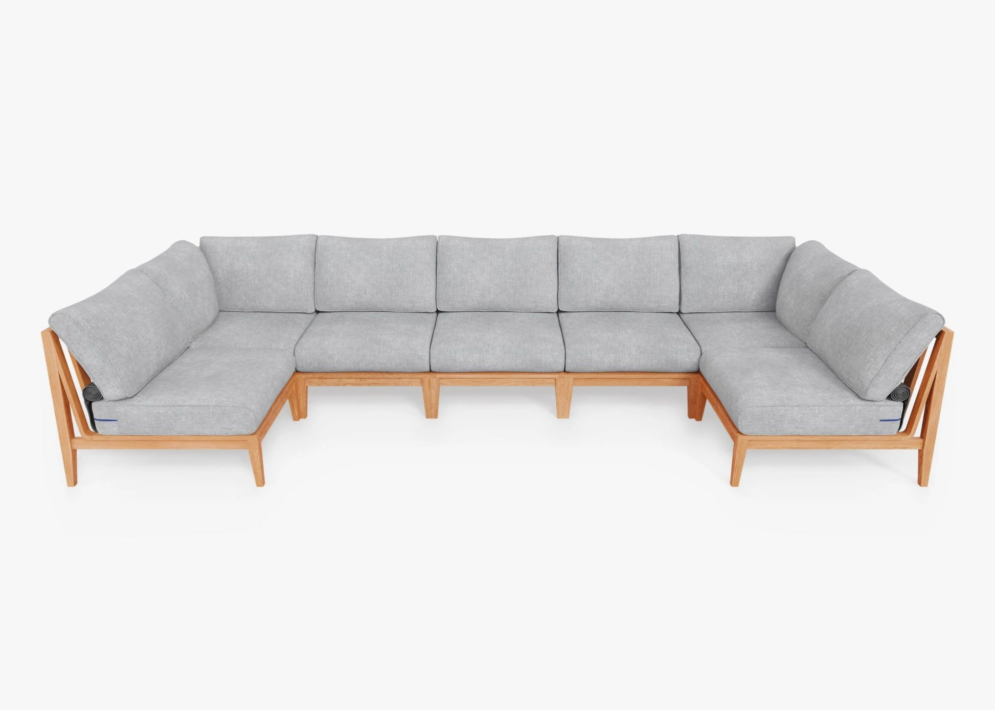 The Teak Outdoor U Sectional - Seven Seat is a spacious, modern piece with a sleek wooden frame and light gray cushions. Its minimalist design offers plenty of seating, set against a plain white background.