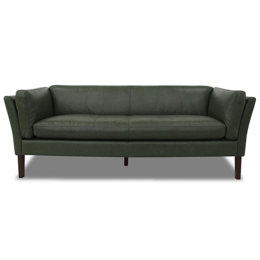 The York - Comfortable Sofa is a dark green, modern leather piece with flared arms and wooden legs, shown from the front against a white background.