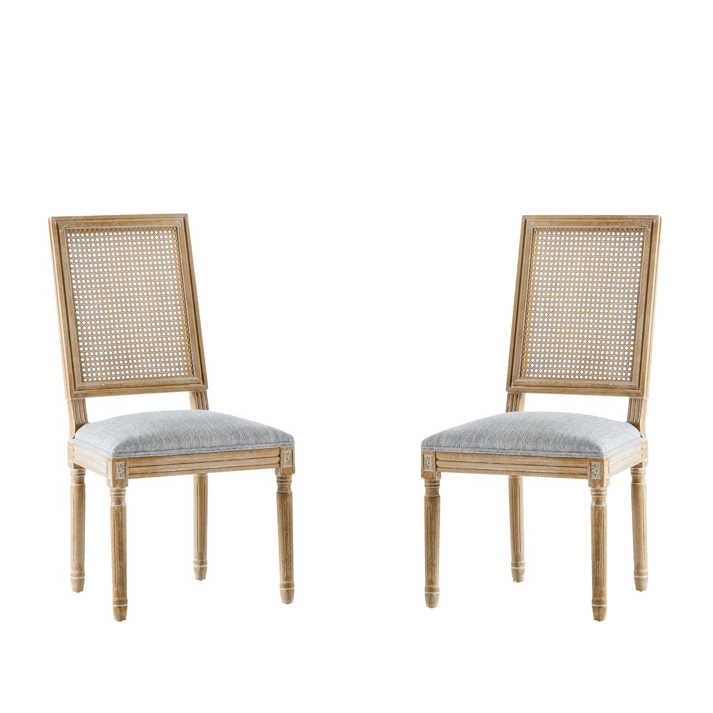 Two French Country Dining Chairs with rectangular cane backrests and smooth upholstered seats, featuring carved legs and a classic, elegant design, are set against a plain white background.