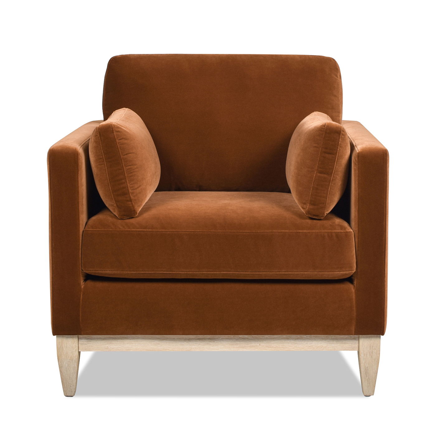 The Knox - Modern Farmhouse Arm Chair features rich brown upholstery, two matching cylindrical side cushions, square arms, and light wooden legs, all showcased against a white background.