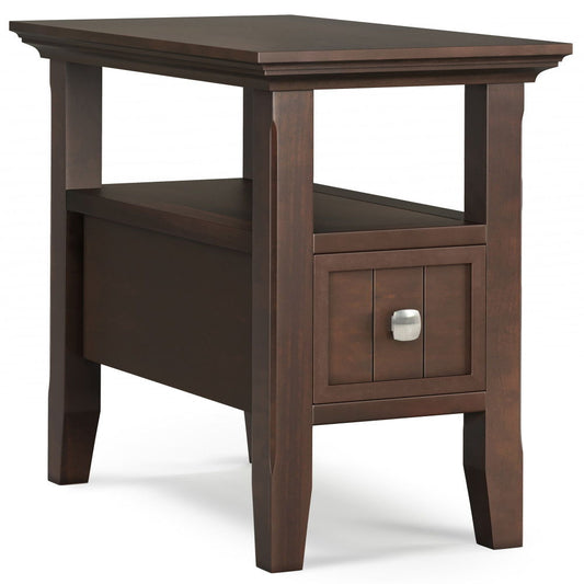 The Acadian Narrow Side Table With Drawer in brown features a square top, small front drawer with silver square knob, lower shelf, slightly tapered legs, and a simple classic design.