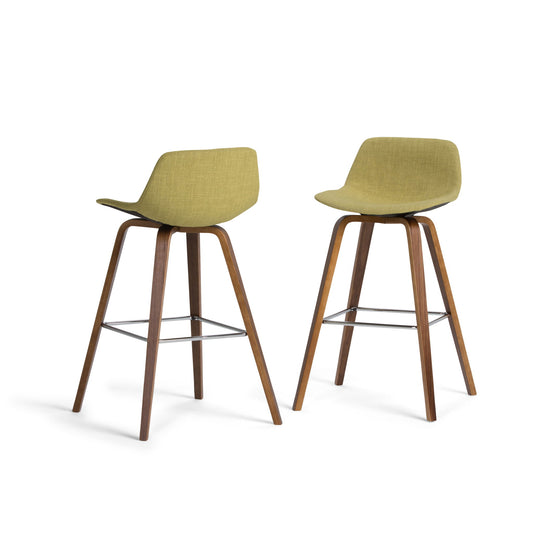 The Randolph Bentwood Counter/Bar Height Stool (Set of 2) features olive green upholstered seats, curved backs, and wooden legs with metal footrests, shown on a white background.