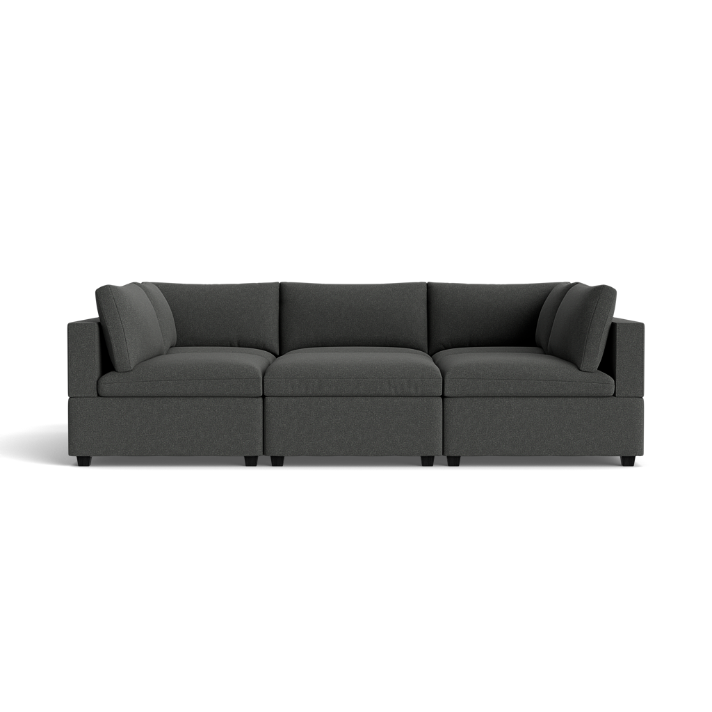 The Kova Box Cushion Pit is a modern, dark gray sectional sofa featuring three seat sections and two matching back cushions, shown against a plain black background.