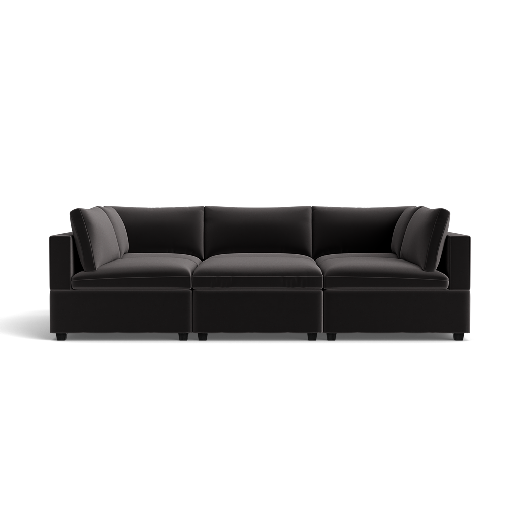 The Kova Box Cushion Pit is a modern, black sectional sofa featuring plush cushions and wide armrests, shown against a plain black background.
