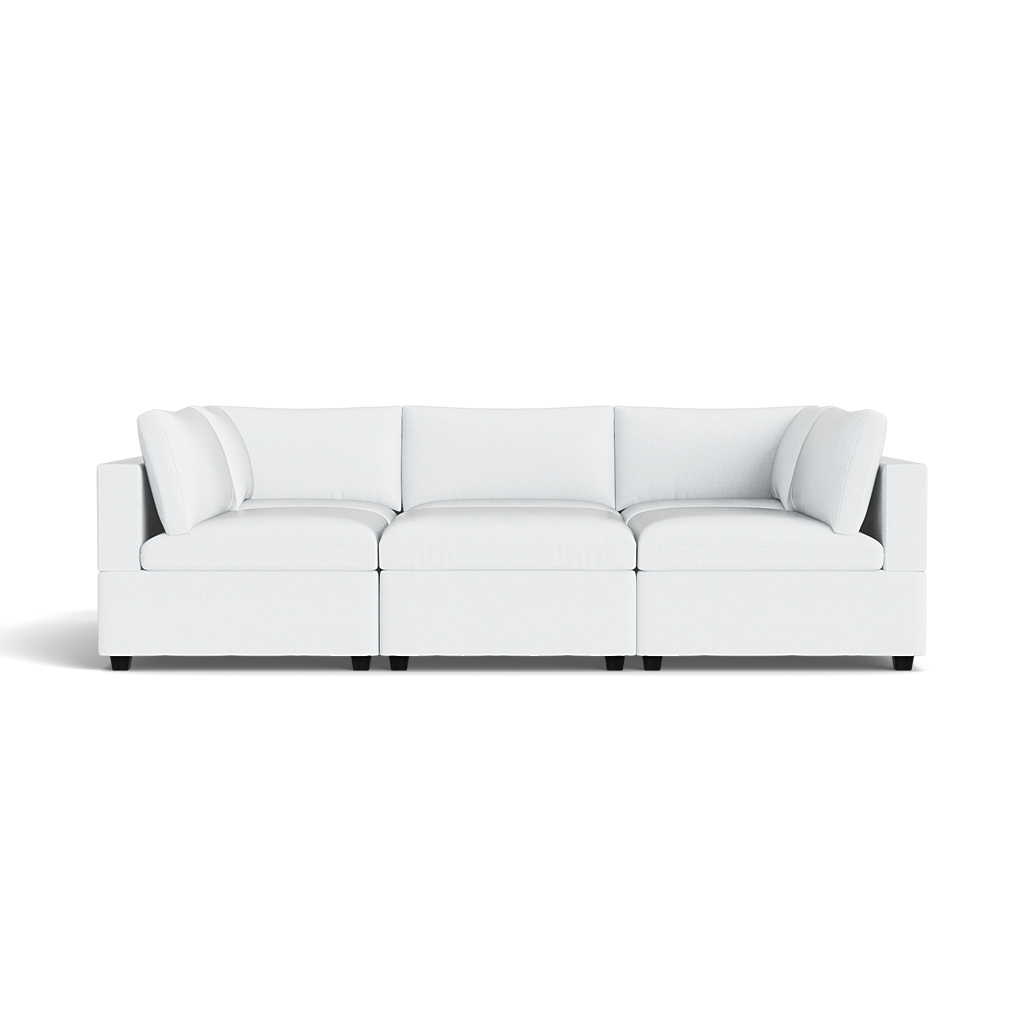 The Kova Box Cushion Pit is a modern white sectional sofa featuring three seat sections and cushioned backrests, shown from the front on a transparent background.