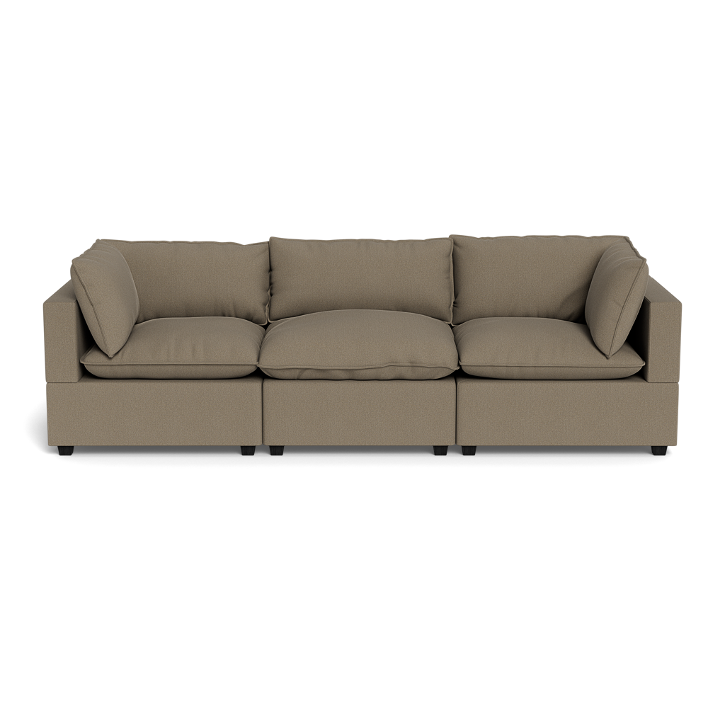 The Kova Pillow Cushion Sofa 122" is a modern, three-section brown sofa with square arms and five matching back cushions, shown from the front against a black background.
