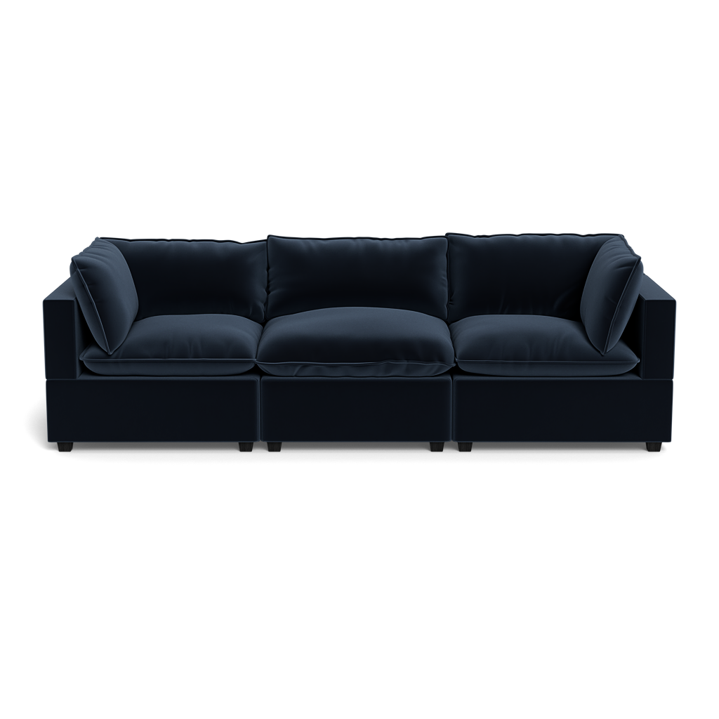 The Kova Pillow Cushion Sofa 122" is a modern, dark blue three-seater with plush cushions and wide armrests, shown from the front against a plain background.