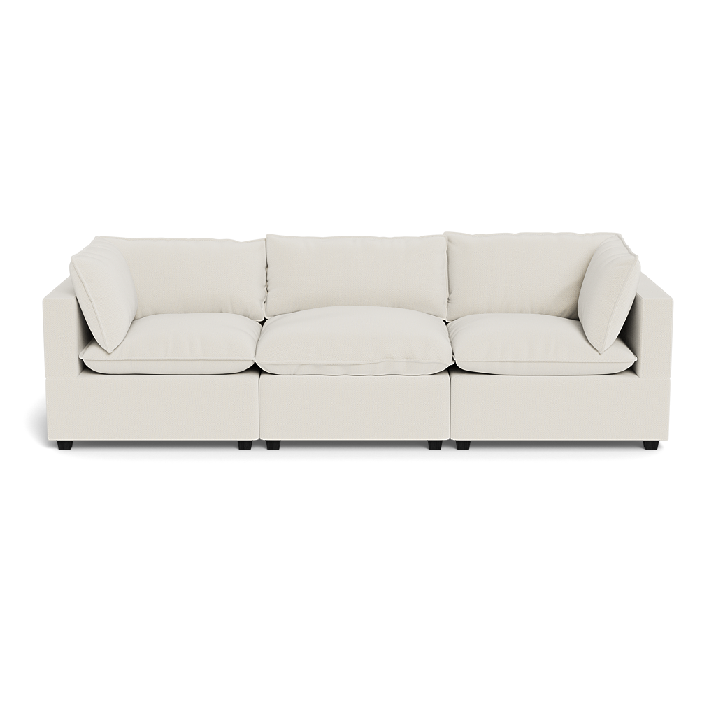 The Kova Pillow Cushion Sofa 122" is a modern, cream three-seater with square armrests and back cushions, shown on a plain, transparent background.