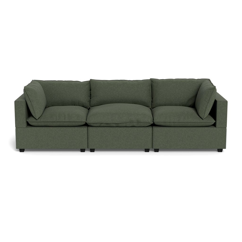 The Kova Pillow Cushion Sofa 122" is a dark green, modern three-seater with square arms and three back cushions, displayed against a plain black background.