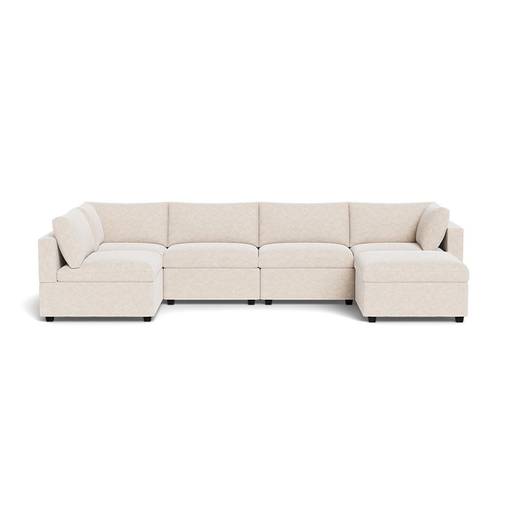 The Kova Box Cushion U-Shape is a large sectional in light beige with a left chaise and right corner seat, featuring plush cushions and a modern design.