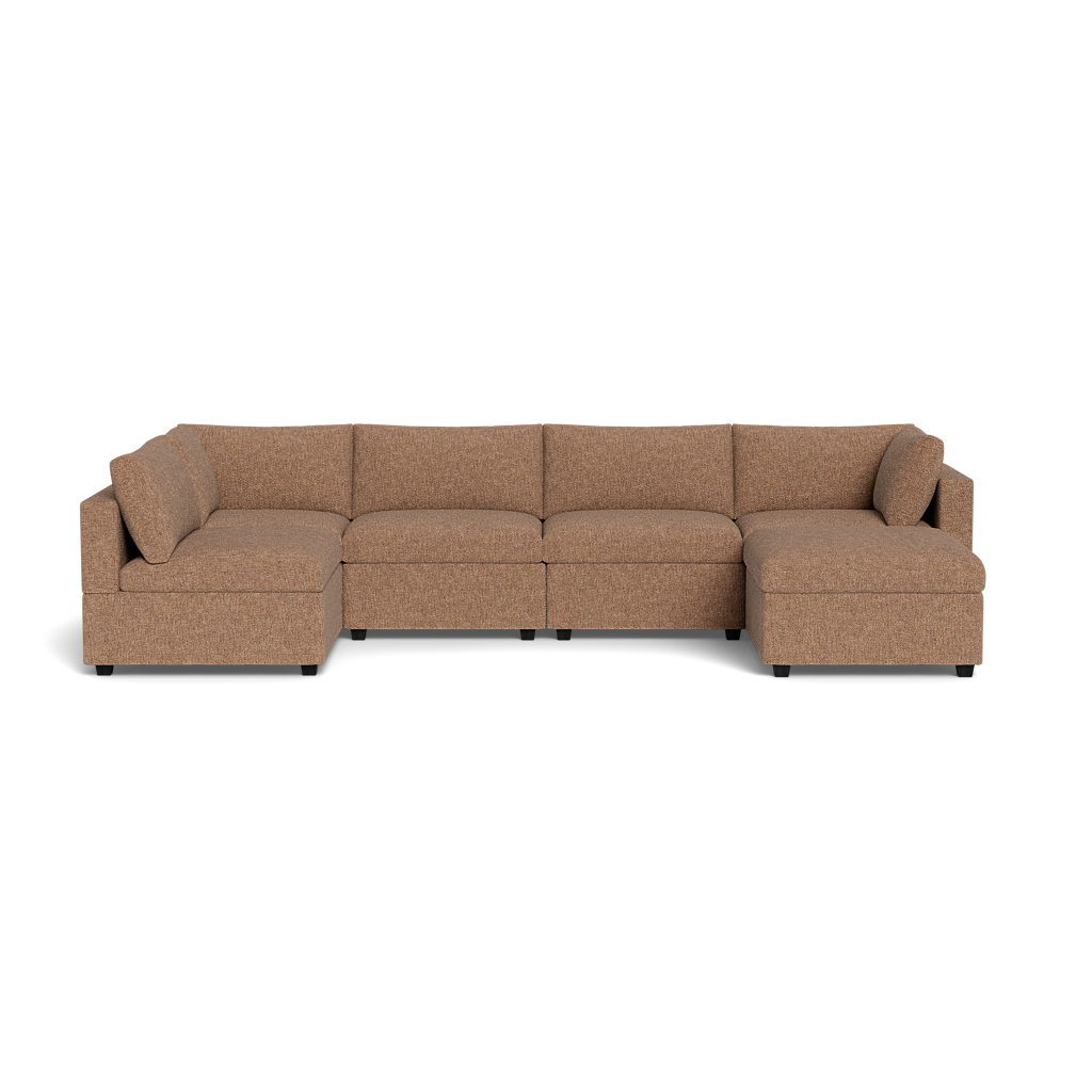The Kova Box Cushion U-Shape is a spacious, brown upholstered sectional with plush cushions and armrests at both ends, displayed against a plain black background.