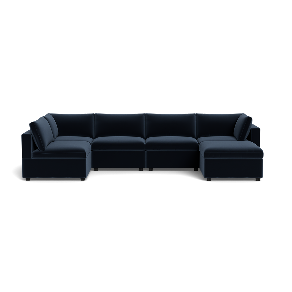 The Kova Box Cushion U-Shape is a modern, large, dark blue sectional sofa with six seats and two corner sections, low backrests, cushioned armrests, and is shown isolated on a transparent background.