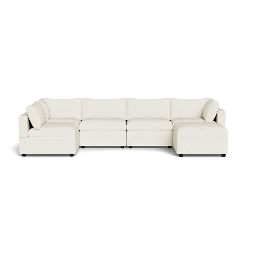 The Kova Box Cushion U-Shape is a spacious, modern off-white sectional with clean lines, plush seat and back cushions, and armrests at both ends, arranged in a U-shape against a plain background.