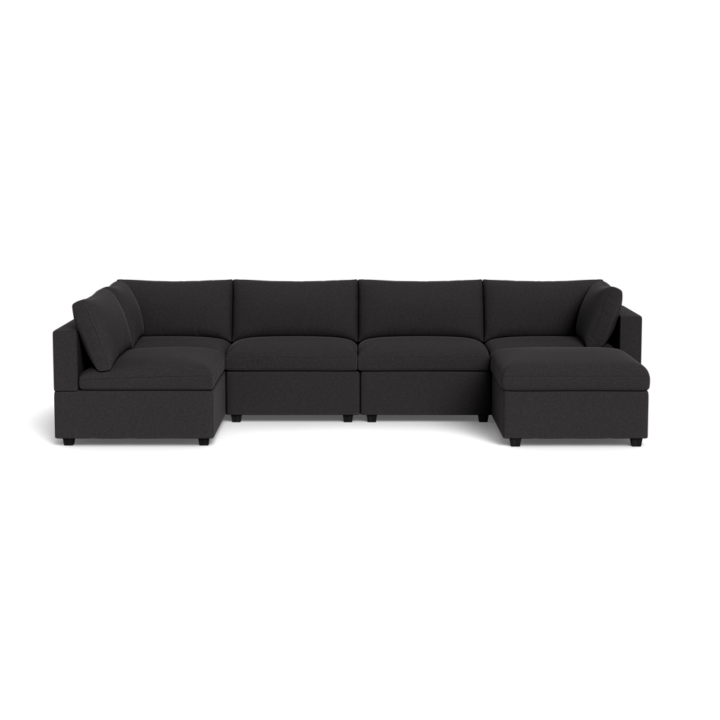 The Kova Box Cushion U-Shape is a modern dark gray sectional sofa featuring three left seat cushions, a corner section, two right seat cushions, and low armrests, shown here against a black background.