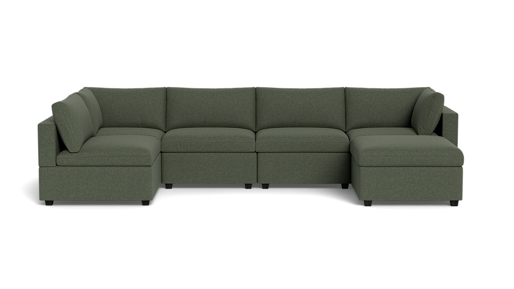 The Kova Box Cushion U-Shape is a green, L-shaped sectional sofa with wide cushions and backrests, shown against a plain black background.