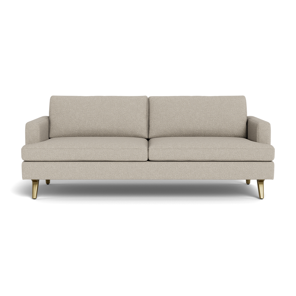 The Lido Sofa 75" is a modern beige fabric sofa with two seat and back cushions, low armrests, and four angled gold legs, shown from the front against a plain black background.