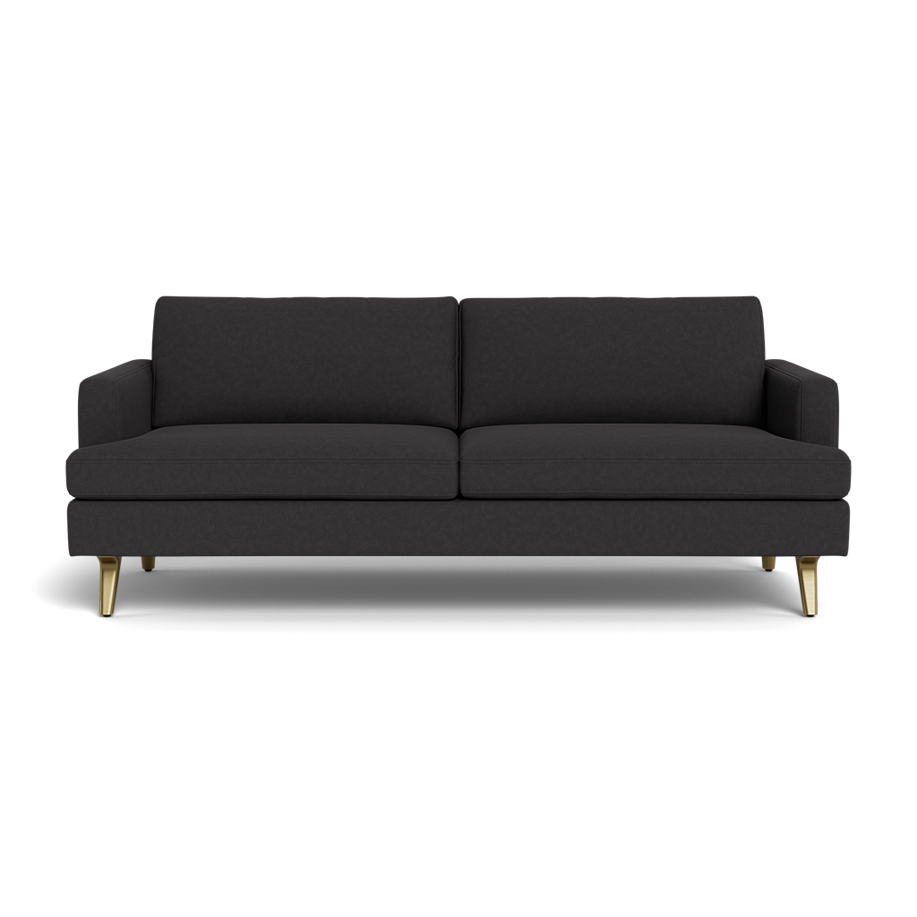 The Lido Sofa 75" is a modern dark gray two-seater with two back cushions and short, angled gold legs, shown front-facing against a black background.