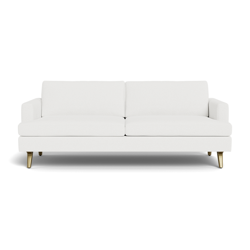 The Lido Sofa 75" is a modern white sofa featuring two seat cushions, two back cushions, and short gold legs, set against a plain black background.