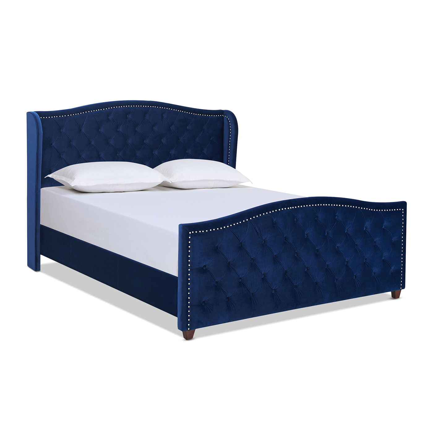 The Marcella - Upholstered Shelter Headboard Bed Set features a blue tufted headboard and footboard with silver nailhead trim, completed with a white mattress and two white pillows.