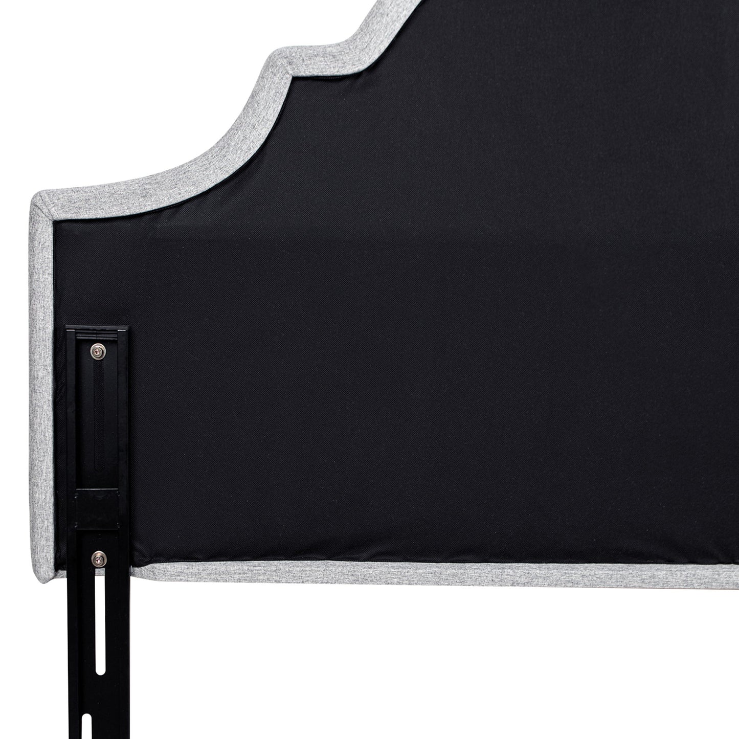 A close-up of the Catherine - Luxurious Comfort Upholstered Headboard features black fabric with a gray trim and scalloped upper edge, attached to a black metal bed frame support.