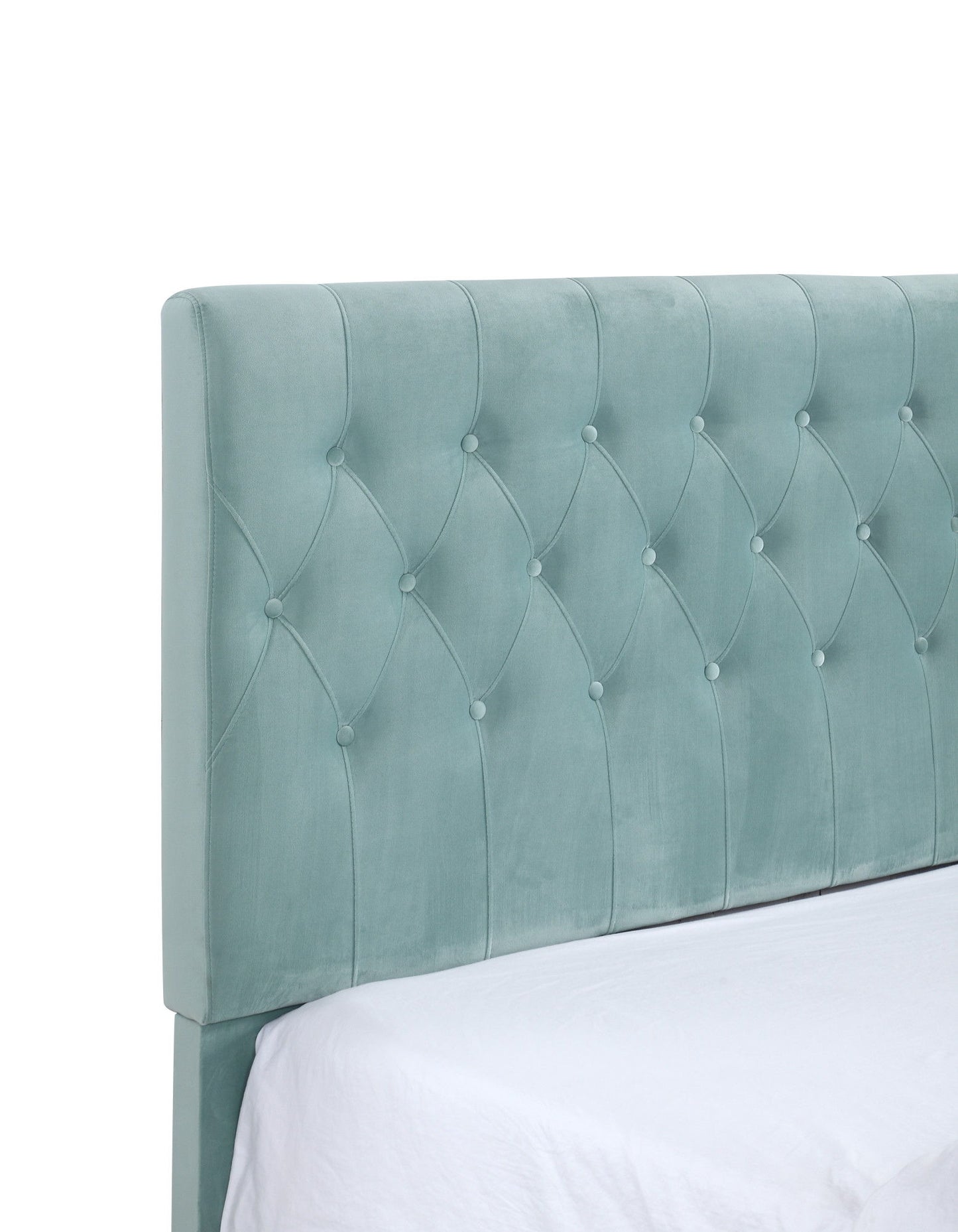 The Luma - Upholstered Bed features a light teal, tufted fabric headboard with button detailing, diamond-pattern stitching, and a soft padded look. Shown attached to a bed with a white sheet.