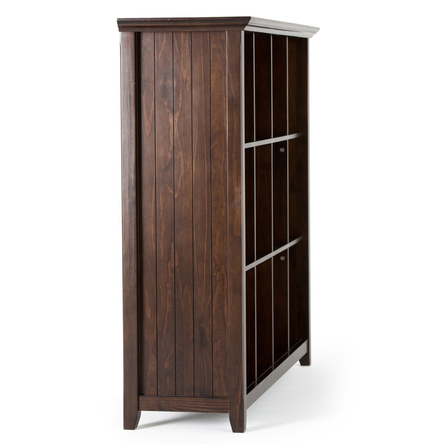 A side view of the Acadian - Handcrafted Cube Storage, a tall dark wood bookcase with vertical paneling and three shelves, set against a white background. Its top surface features a slightly lighter color tone.