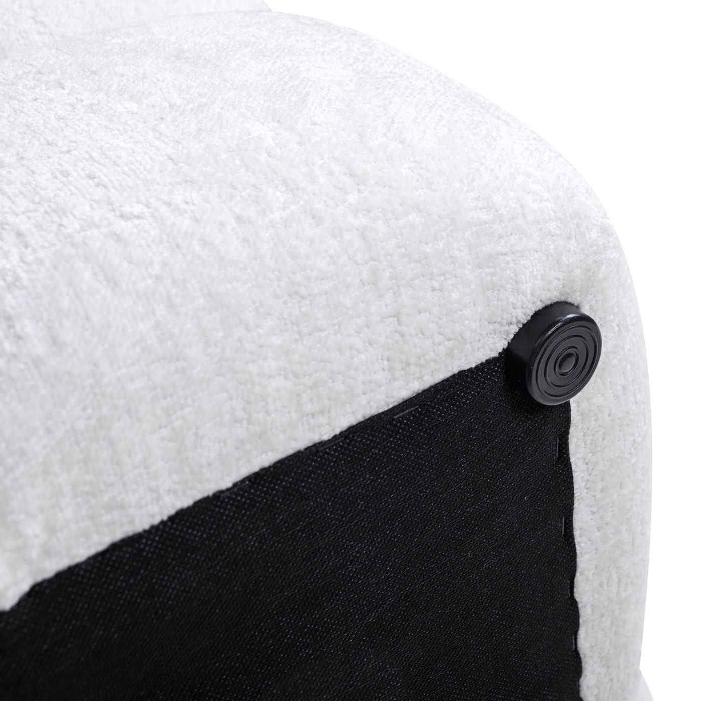 Close-up of the corner of the Pixel Oversized Square Tufted Pouf Ottoman in Almond White, featuring white textured fabric, a black underside, and a round black plastic foot at the corner.