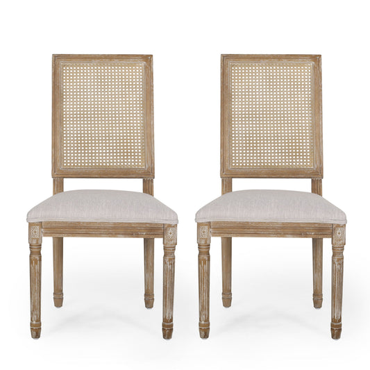 Two French Country Dining Chairs with rectangular cane backrests, smooth upholstered beige seats, carved legs, and a rustic light wood finish, shown against a plain white background.